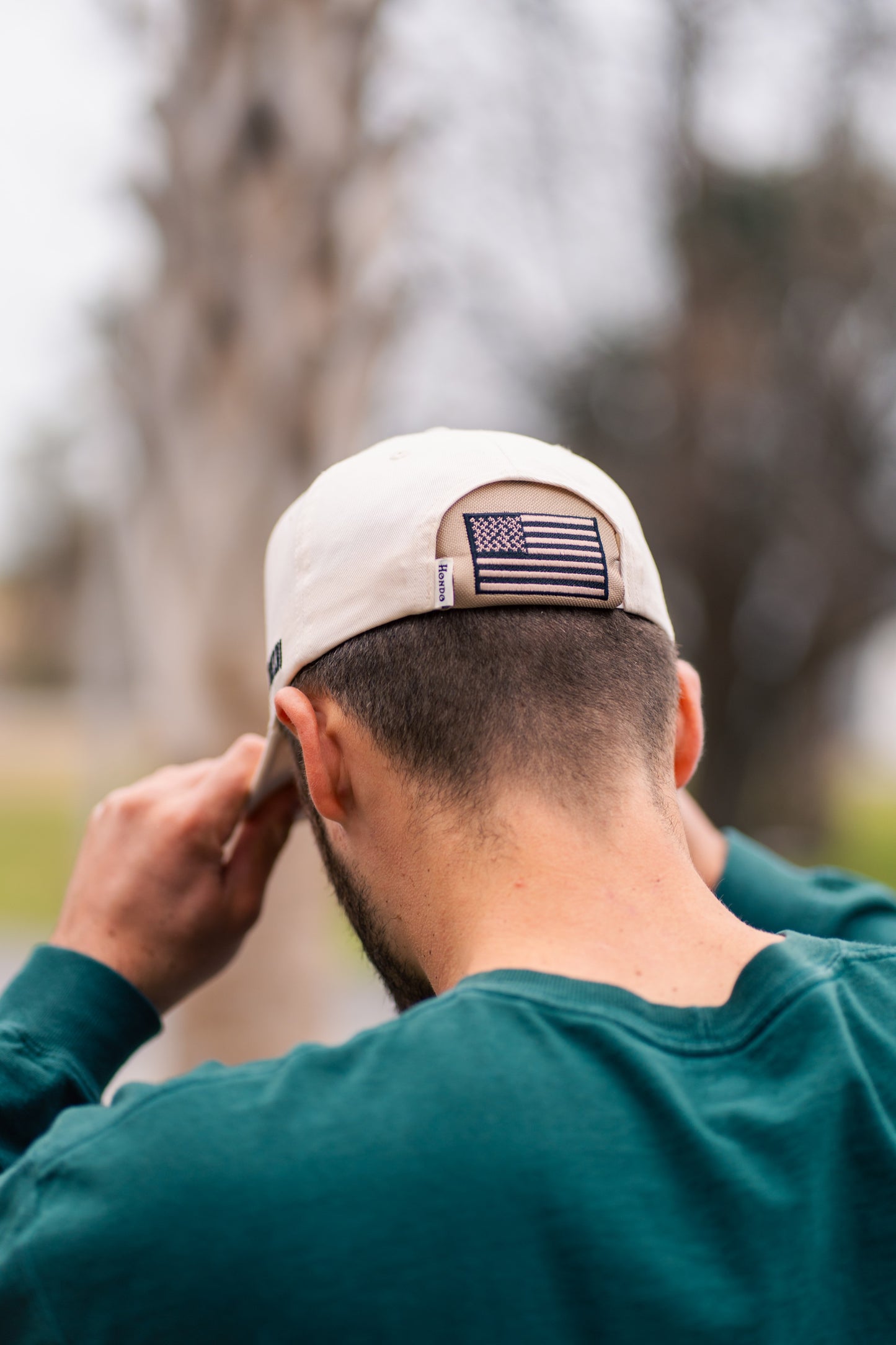 American Flag Kap-Bak - hand on brim outdoor