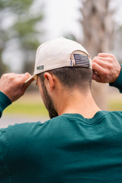 American Flag Kap-Bak - both hands adjusting cap